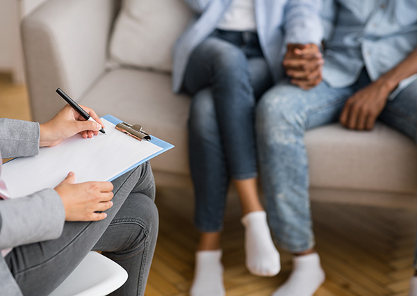 Couple sitting together in therapy session | Fountaingate Wellness Couple sitting together in therapy session