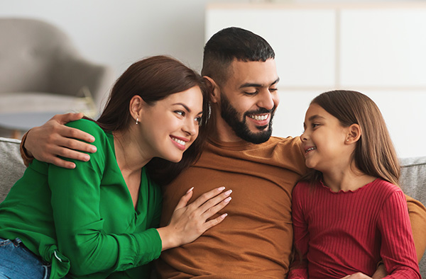 Happy family sitting together at home